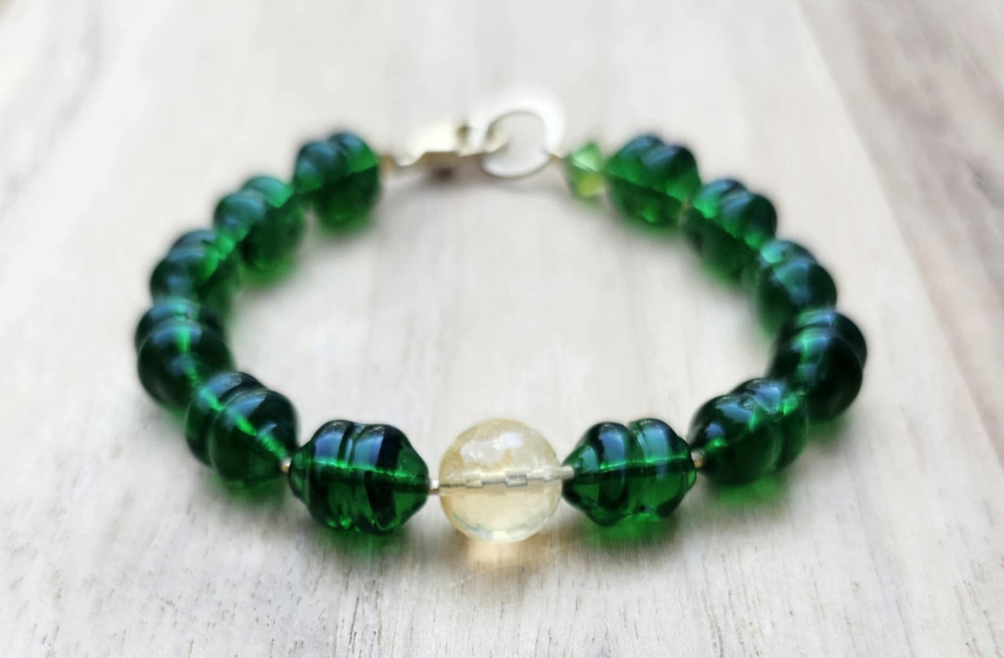 Money bracelet of green beads with Citrine focus