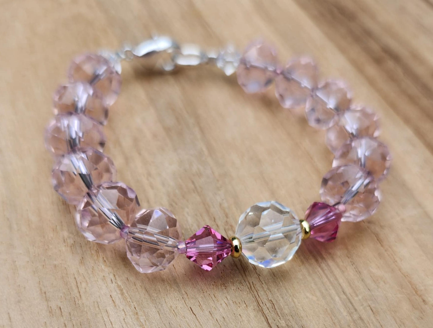 Love bracelet of pink faceted glass beads