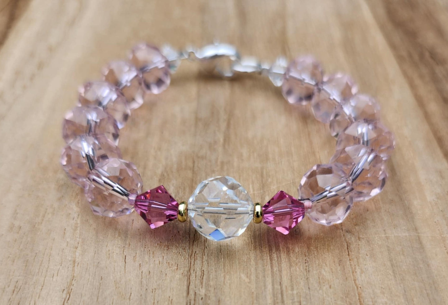Love bracelet of pink faceted glass beads