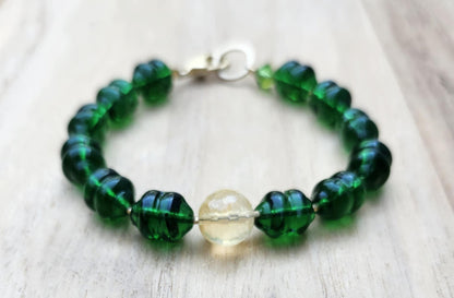 Money bracelet of green beads with Citrine focus