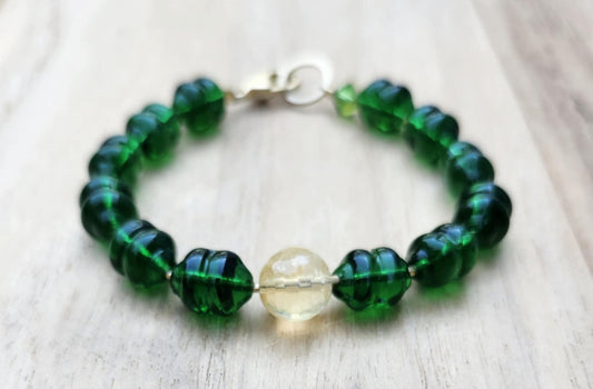 Money bracelet of green beads with Citrine focus