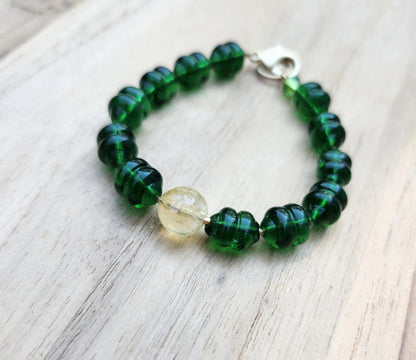 Money bracelet of green beads with Citrine focus