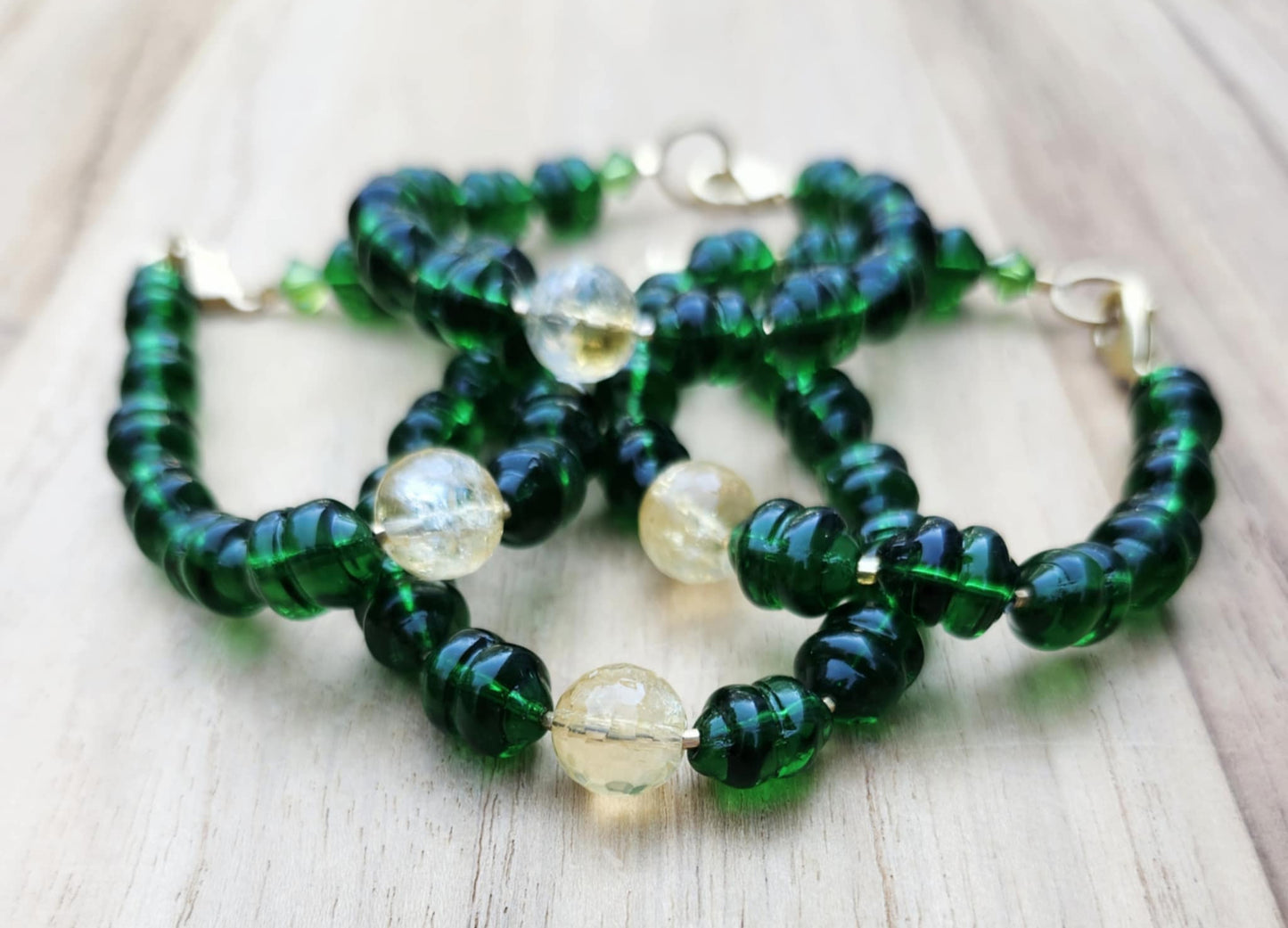 Money bracelet of green beads with Citrine focus