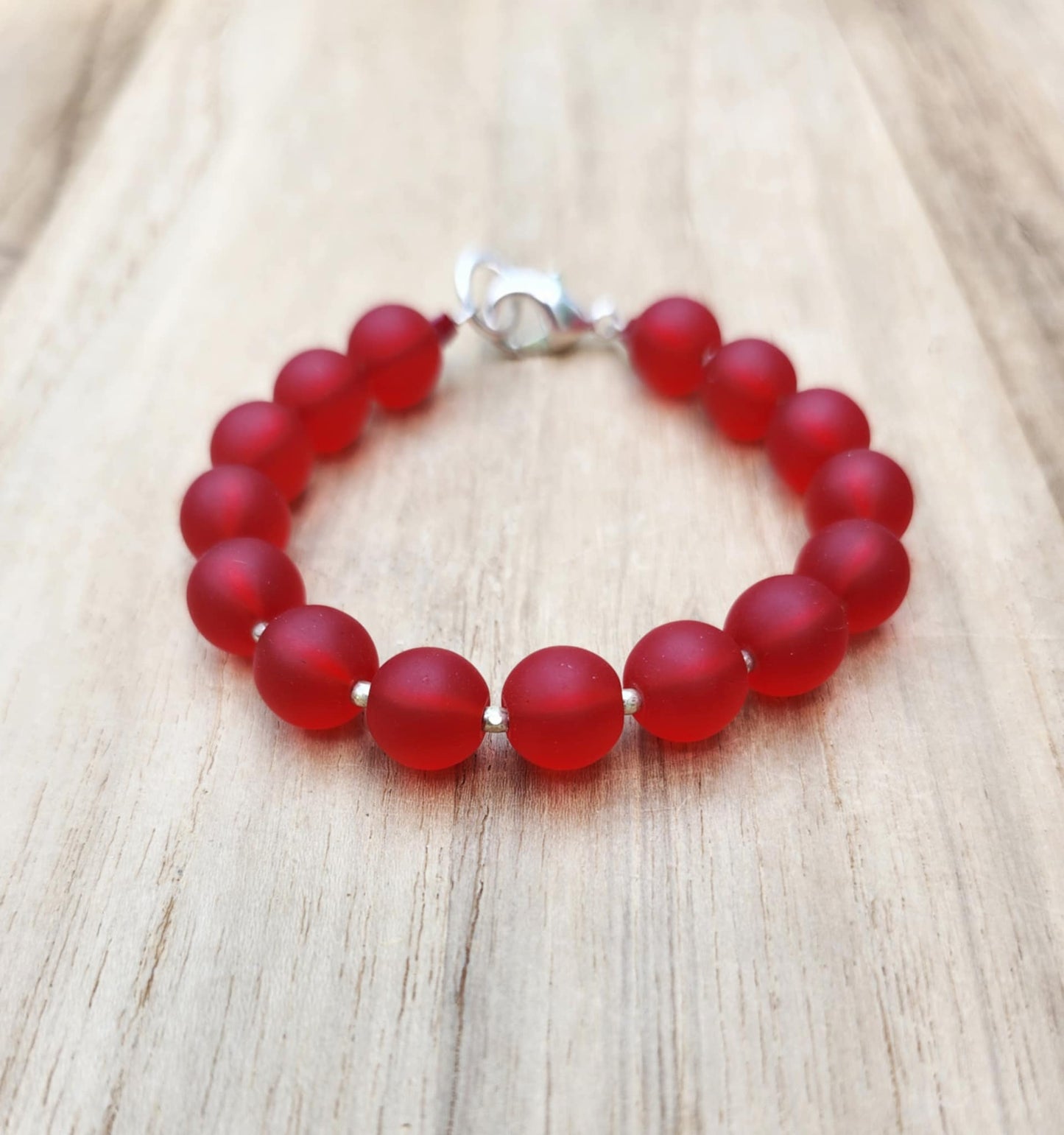 Protection bracelet of recycled red glass beads