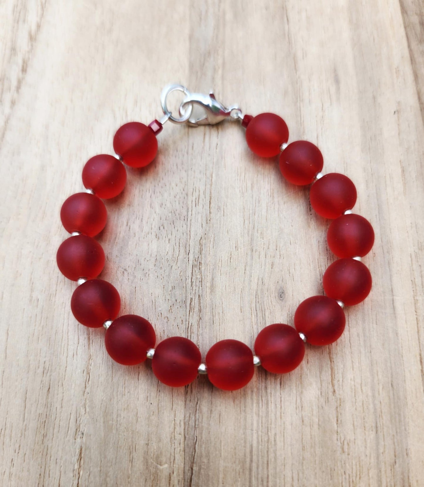 Protection bracelet of recycled red glass beads