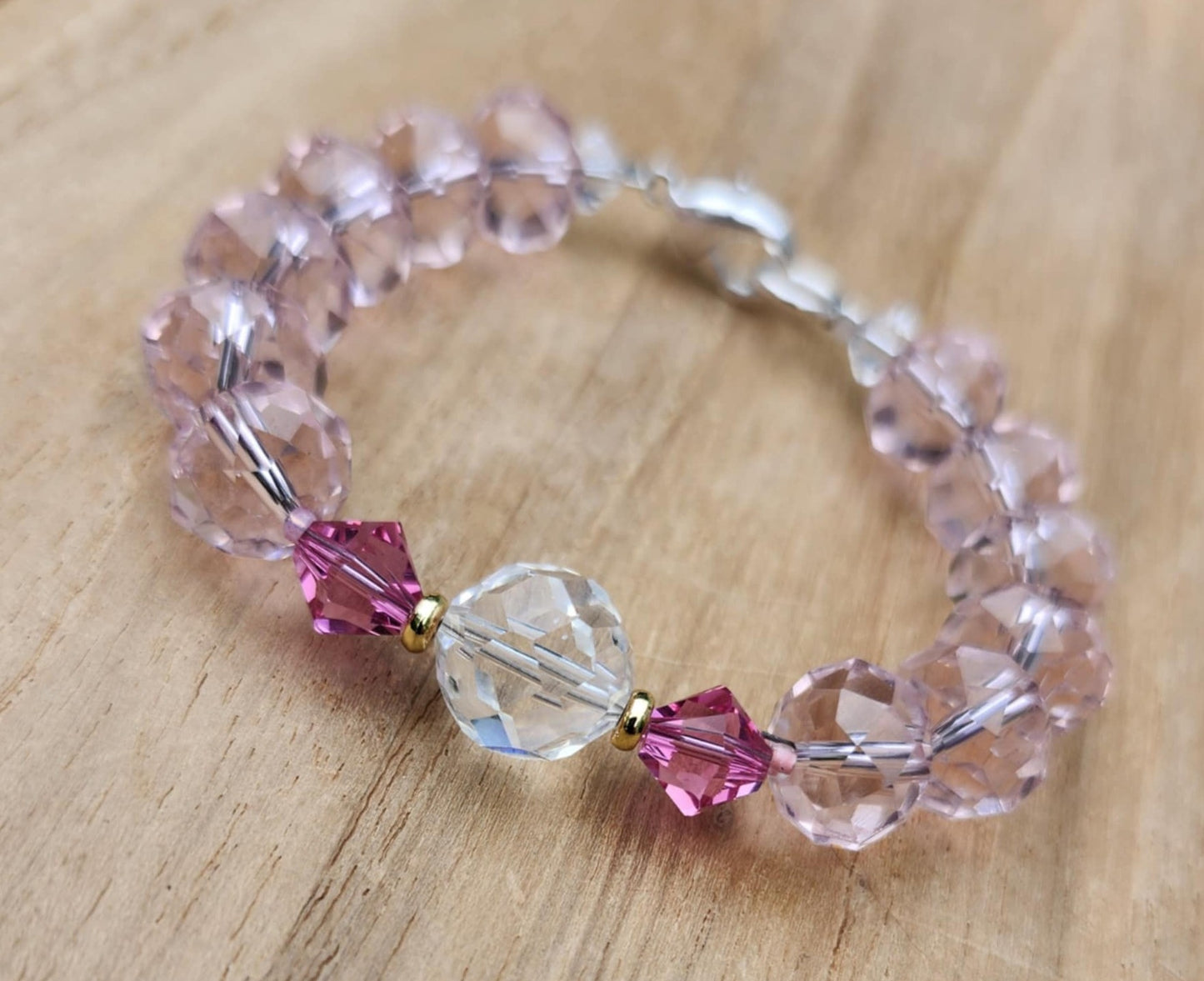 Love bracelet of pink faceted glass beads